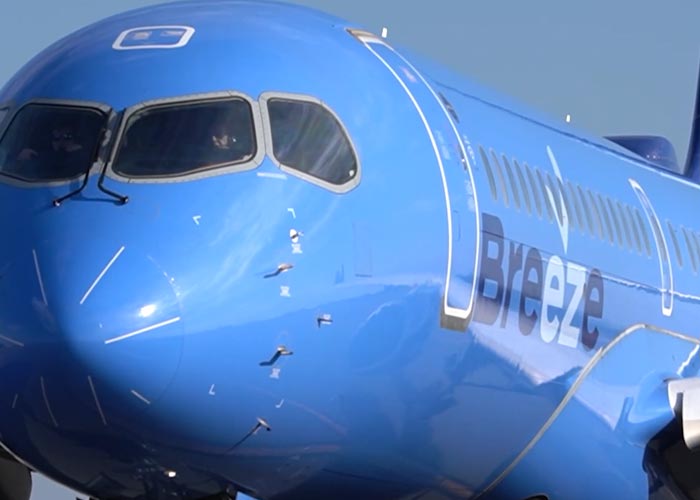 Different close up and further away shots of a Breeze aircraft at Bradley International Airport