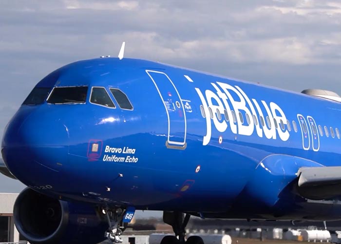 Several different shots of a JetBlue aircraft taxiing and at the gates at Bradley International Airport.
